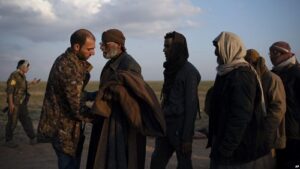 Kurdish-SDF forces processing Syrian refugees fleeing ISIS.