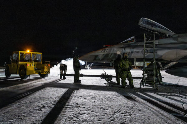 Members of the Air Task Force (ATF) prepare a Royal Canadian Air ForceCF-188 Hornet at Pituffik Space Base, Greenland, on Jan. 22, 2026, as part of Operation NOBLE DEFENDER, a recurring air defense conducted under the direction of the North American Aerospace Defense Command. The exercise is designed to validate NORAD’s capability to defend Canada and the United States against threats. (Royal Canadian Air Force photo by Master Cpl. Bélynda Casse, 3 Wing Bagotville)